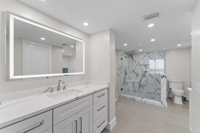 bathroom with vanity, toilet, and walk in shower