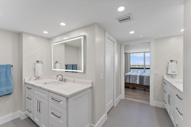 bathroom featuring vanity and wood-type flooring