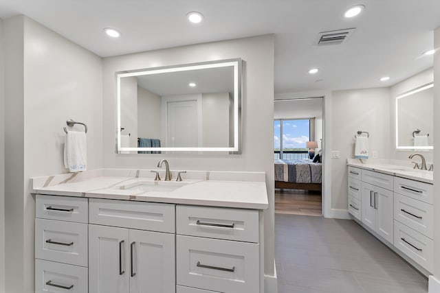 bathroom featuring vanity and wood-type flooring