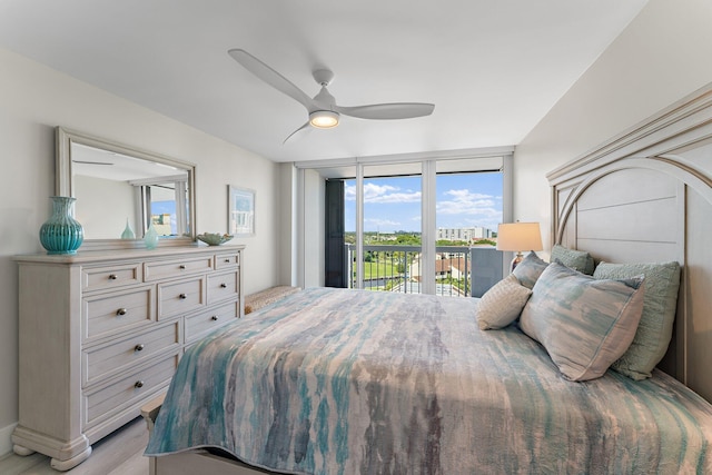 bedroom with access to outside, ceiling fan, and light hardwood / wood-style floors