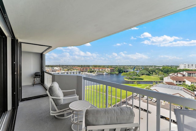 balcony with a grill and a water view