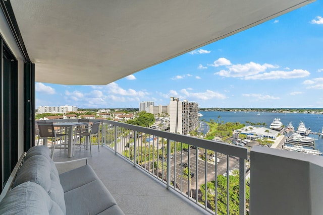 balcony featuring a water view