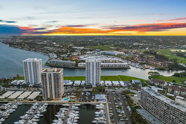 aerial view at dusk with a water view