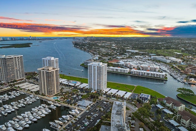 aerial view at dusk with a water view