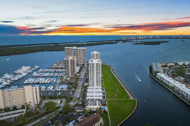 aerial view at dusk with a water view