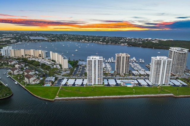 aerial view at dusk with a water view