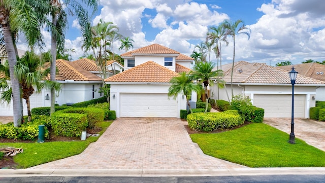 mediterranean / spanish-style home featuring a garage