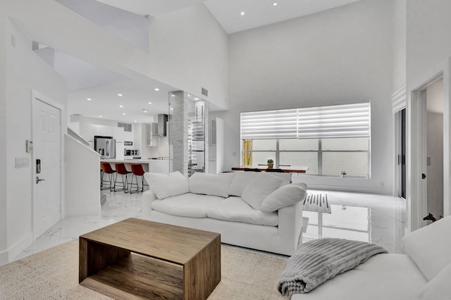 living room featuring a high ceiling