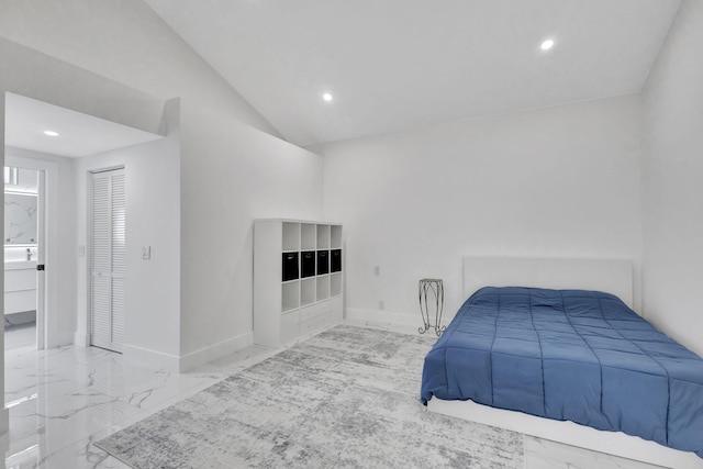 bedroom with a closet and lofted ceiling