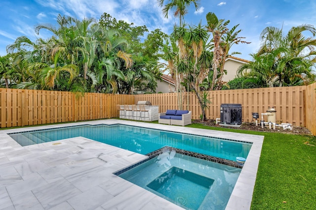 view of pool with an outdoor hangout area, a patio area, and an in ground hot tub