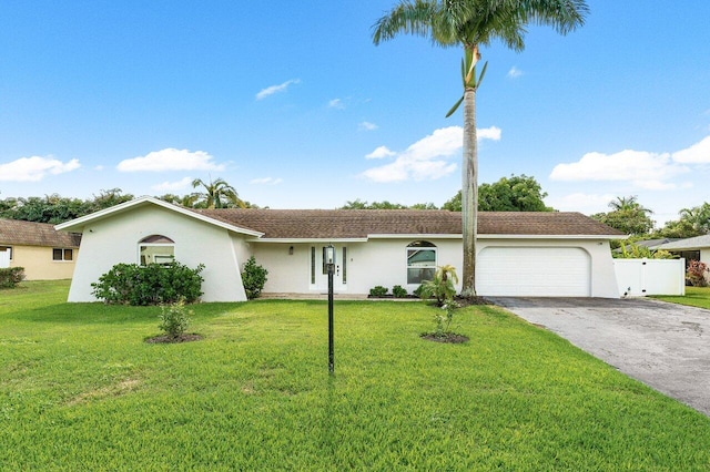 single story home with a front lawn and a garage