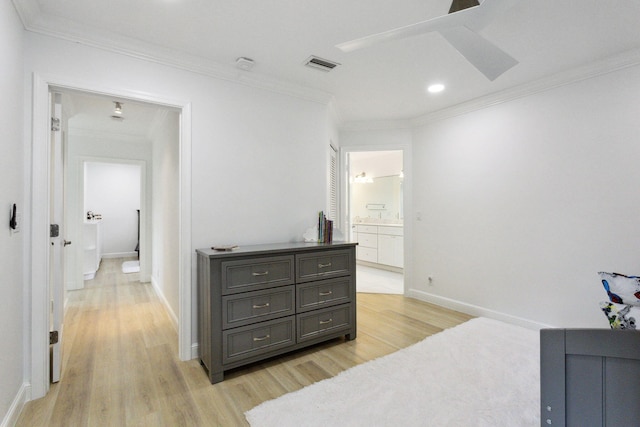 bedroom featuring light hardwood / wood-style flooring, ceiling fan, crown molding, and ensuite bathroom