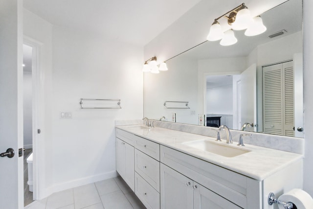 bathroom with vanity and tile patterned flooring