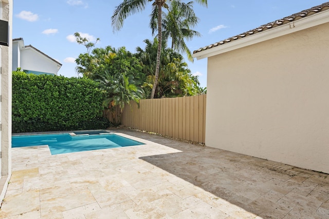 view of swimming pool with a patio