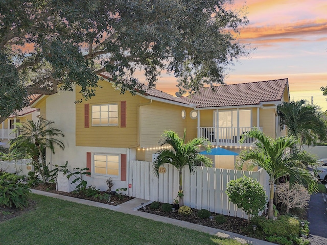 view of front of home with a yard