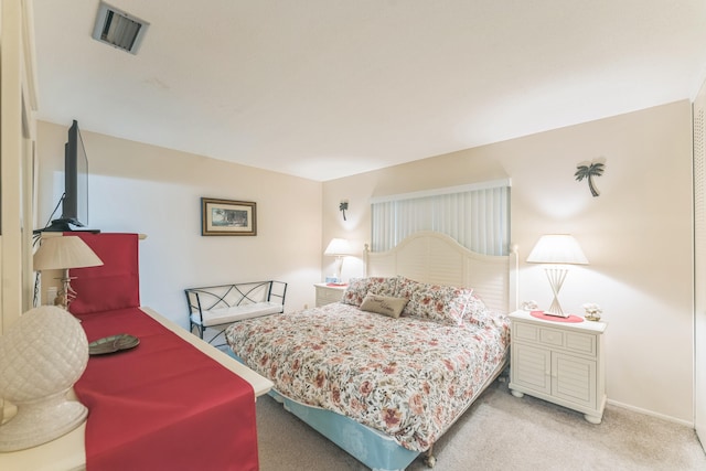 bedroom with light colored carpet