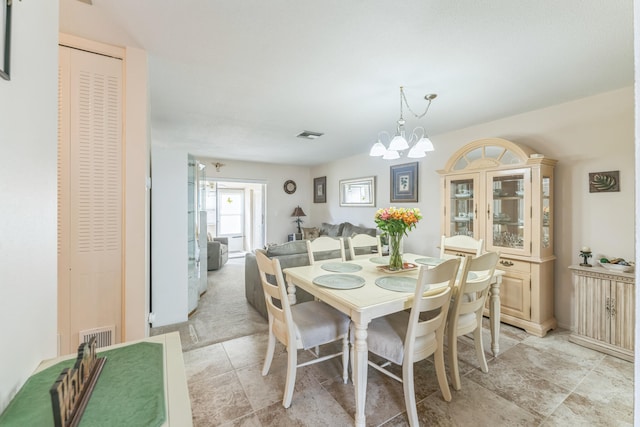 dining room featuring a notable chandelier