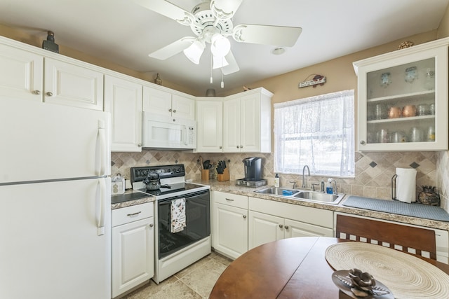 kitchen featuring white appliances, ceiling fan, white cabinetry, and sink