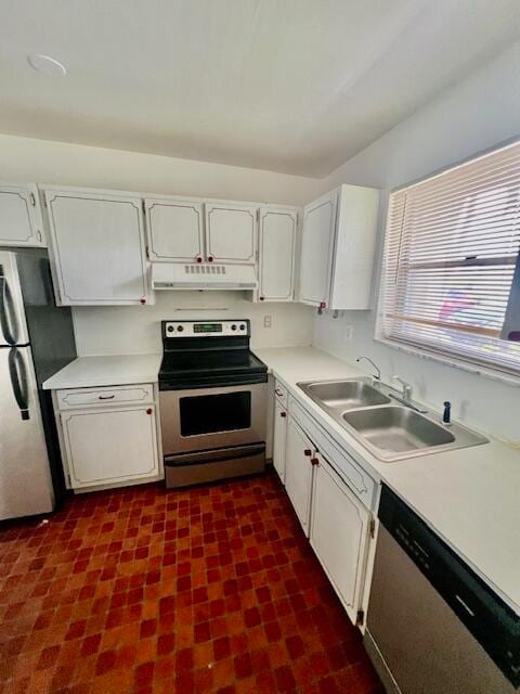 kitchen with white cabinets, appliances with stainless steel finishes, and sink