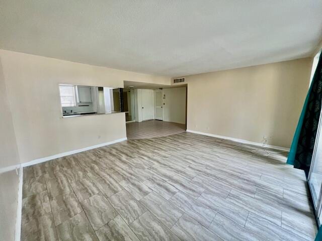 unfurnished living room featuring light wood-type flooring