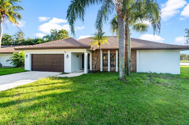 single story home with a garage and a front yard