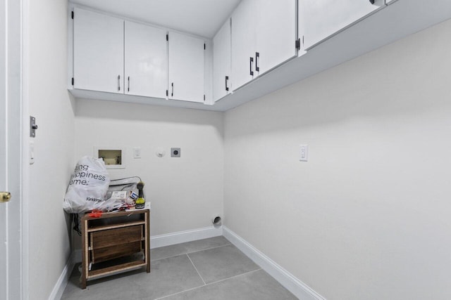 clothes washing area with washer hookup, cabinets, light tile patterned flooring, and hookup for an electric dryer