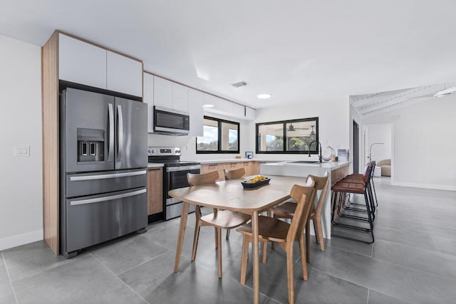 dining area featuring sink