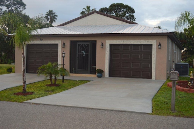 single story home with a garage and cooling unit