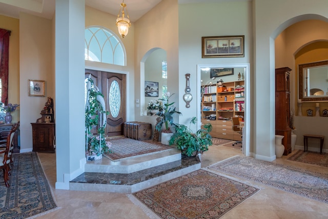 foyer entrance featuring a high ceiling