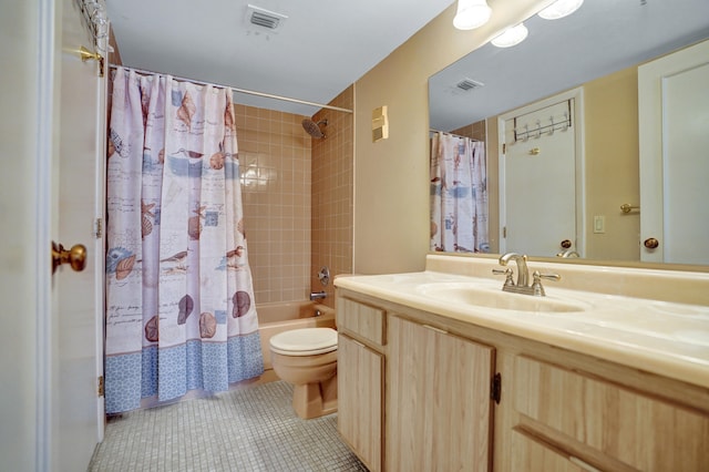 full bathroom with tile patterned flooring, vanity, shower / bath combination with curtain, and toilet