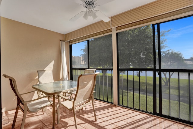 sunroom featuring ceiling fan