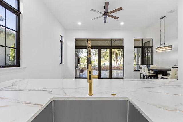 interior space featuring french doors, recessed lighting, visible vents, and light stone countertops