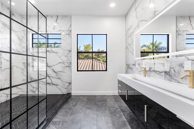 bathroom featuring a wealth of natural light, vanity, a marble finish shower, and recessed lighting