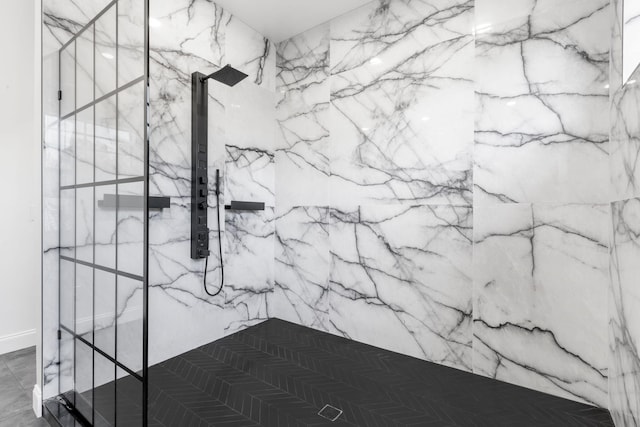 details featuring a marble finish shower