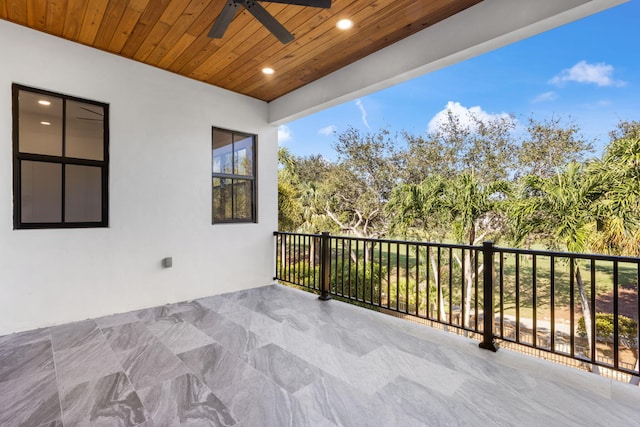 view of patio / terrace with ceiling fan and a balcony