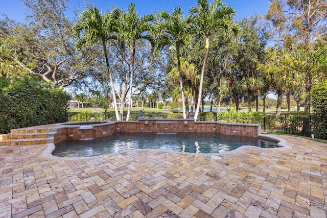 view of swimming pool featuring a fenced in pool, a patio area, fence, and an in ground hot tub