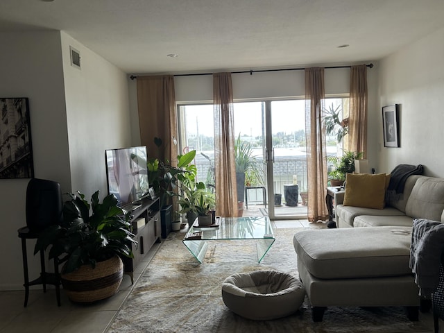 living room with tile patterned flooring