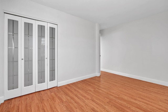 unfurnished room featuring light hardwood / wood-style floors