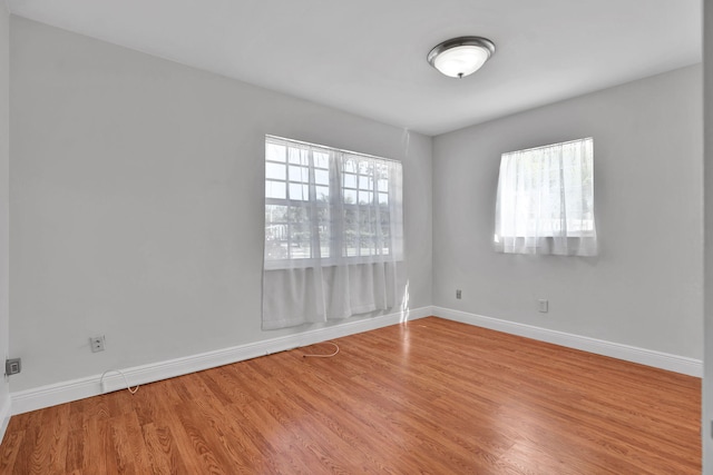 unfurnished room featuring hardwood / wood-style floors