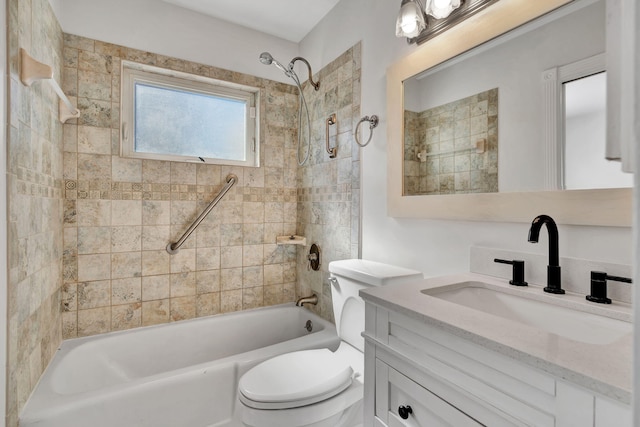 full bathroom featuring vanity, toilet, and tiled shower / bath