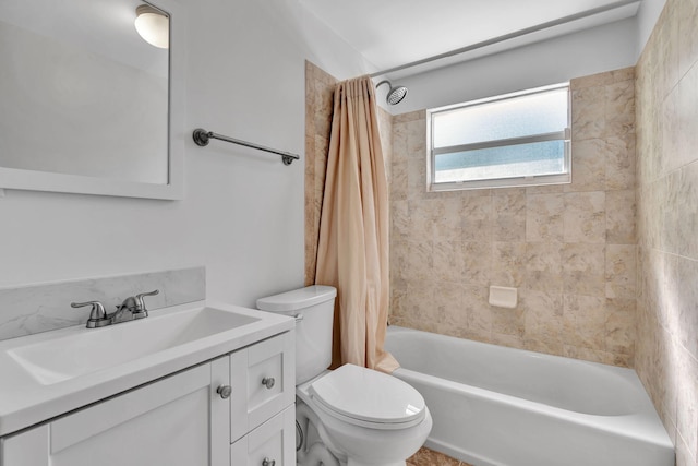 full bathroom featuring shower / bath combo, vanity, and toilet