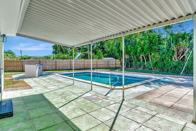 view of swimming pool with a patio