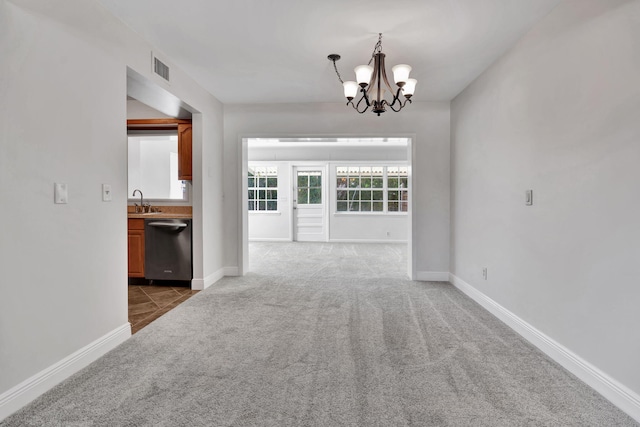 unfurnished dining area featuring carpet flooring, a notable chandelier, and sink