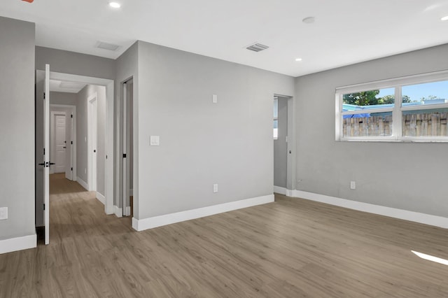 spare room with light wood-type flooring