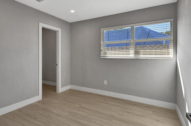 empty room with light wood-type flooring