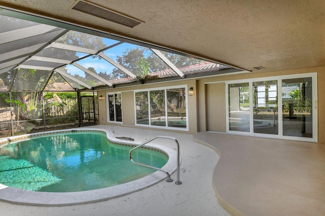 view of pool with a lanai and a patio area