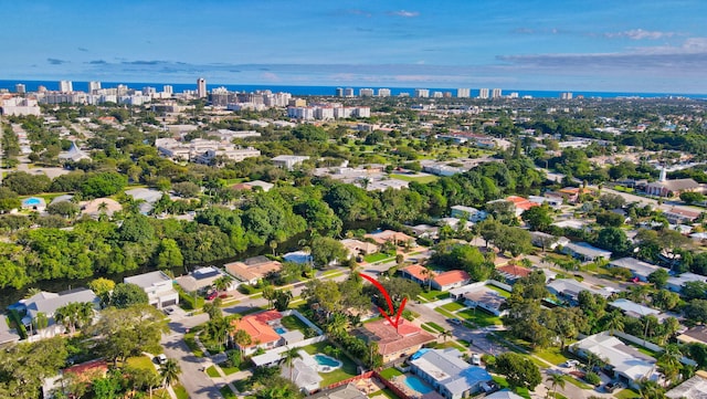 birds eye view of property featuring a water view