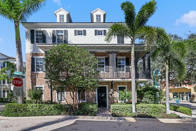 view of front of house with a balcony