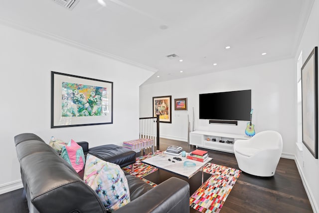 living room featuring crown molding and dark wood-type flooring