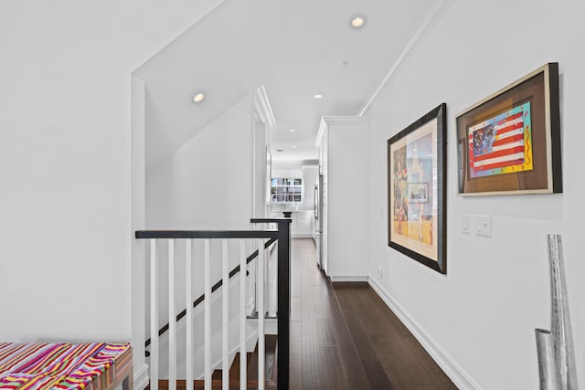 hallway with crown molding and dark wood-type flooring